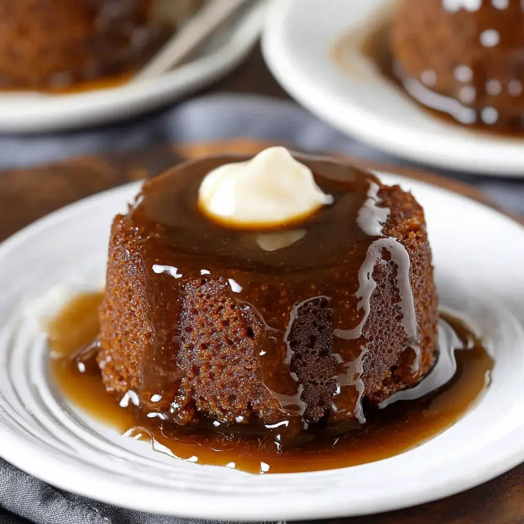Here’s a luscious chocolate cake with creamy sauce dribbling down, topped with whipped cream, and set on a white plate.